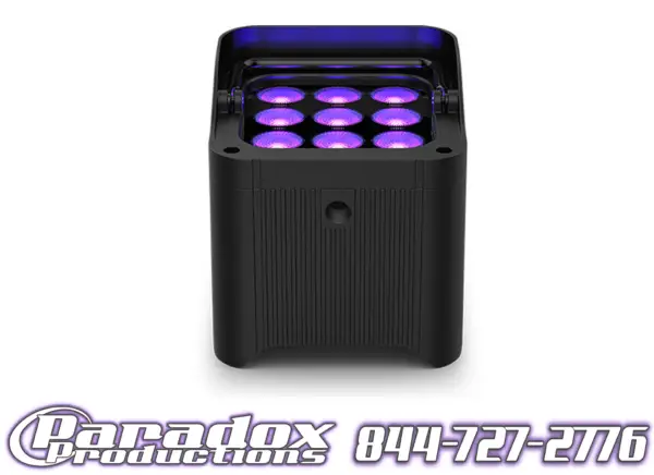 The room's ambience is enhanced with a black fixture projecting purple lights, featuring "Paradox Productions" and "844-727-2776" in a stylized font. Ideal for dynamic atmospheres, Flarecon-controlled lighting creates the perfect effect.