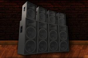 A group of speakers with audio equipment rentals in front of a brick wall.